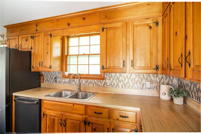 4600 Saunders Ave, Nashville, TN 37216 - kitchen featuring dishwashing machine, a sink, light countertops, backsplash, and brown cabinetry
