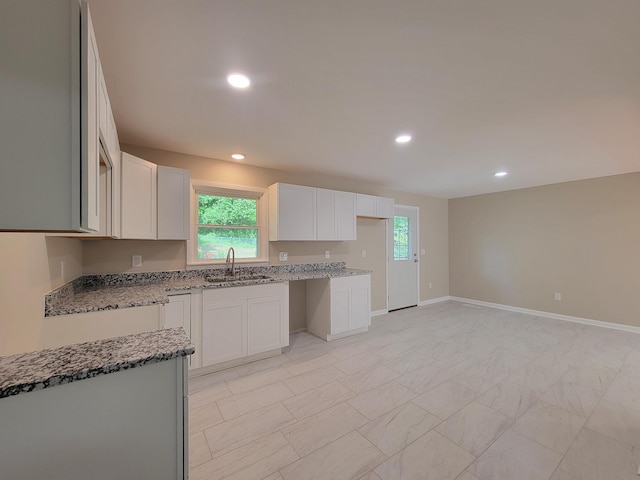 2172 Columbia Hwy, Pulaski, TN 38478 - kitchen with light stone countertops, a sink, plenty of natural light, recessed lighting, and white cabinets