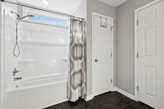 215 Azalea Dr, Oak Grove, KY 42262 - bathroom featuring shower / tub combo with curtain, baseboards, and wood finished floors