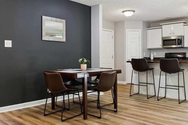 215 Azalea Dr, Oak Grove, KY 42262 - dining space featuring light wood finished floors and baseboards