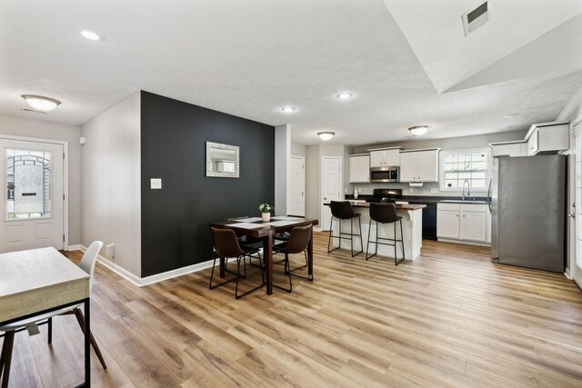 215 Azalea Dr, Oak Grove, KY 42262 - dining area with light wood-style floors, recessed lighting, and baseboards