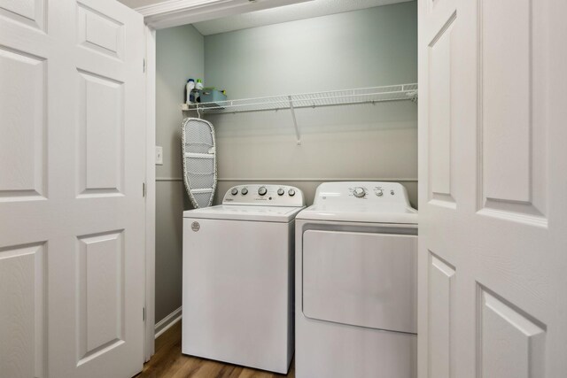 215 Azalea Dr, Oak Grove, KY 42262 - washroom featuring washer and clothes dryer and wood finished floors