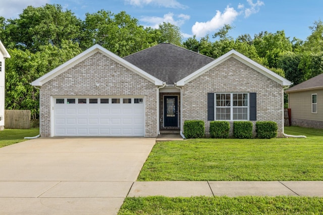 215 Azalea Dr, Oak Grove, KY 42262 - single story home featuring driveway, an attached garage, brick siding, and roof with shingles