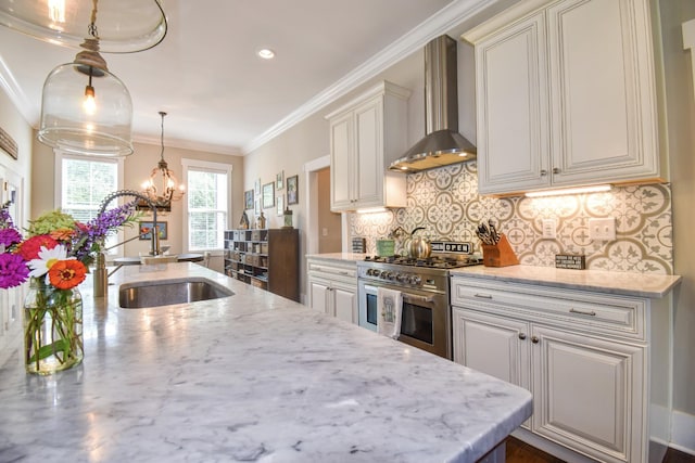 2914 Chasepointe Pl, Columbia, TN 38401 - kitchen with wall chimney exhaust hood, stainless steel stove, a sink, a chandelier, and tasteful backsplash