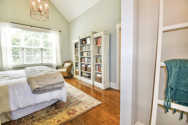 2914 Chasepointe Pl, Columbia, TN 38401 - bedroom with high vaulted ceiling, a chandelier, wood finished floors, and baseboards