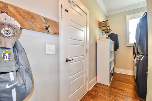 2914 Chasepointe Pl, Columbia, TN 38401 - laundry area with stacked washer / dryer, crown molding, dark wood-type flooring, and baseboards