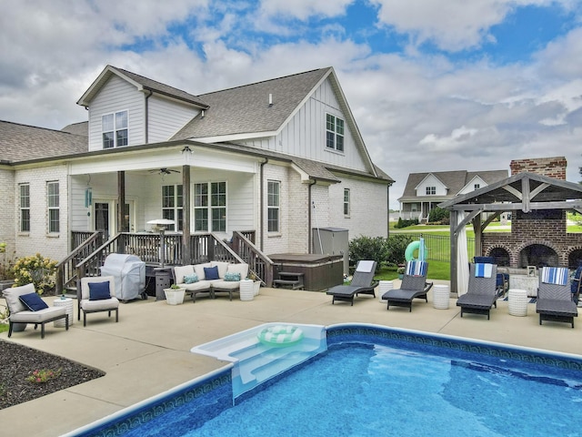 2914 Chasepointe Pl, Columbia, TN 38401 - back of property featuring outdoor lounge area, a hot tub, board and batten siding, and a patio area