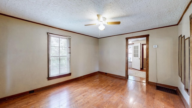 1009 5th Ave W, Springfield, TN 37172 - empty room with light wood-style floors, ceiling fan, crown molding, baseboards, and a textured ceiling