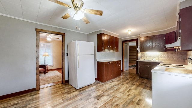 1009 5th Ave W, Springfield, TN 37172 - kitchen with white appliances, ceiling fan, light wood-style floors, backsplash, and crown molding