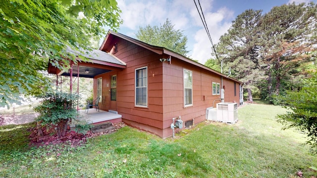 1009 5th Ave W, Springfield, TN 37172 - view of home's exterior featuring a yard, central air condition unit, and a porch