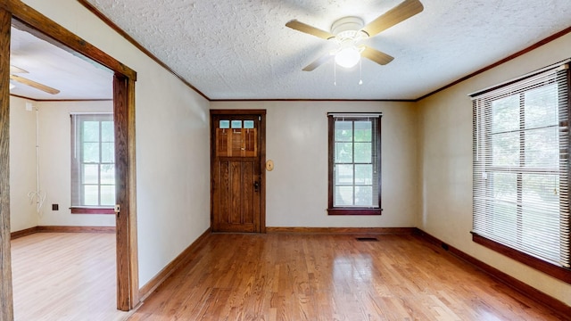 1009 5th Ave W, Springfield, TN 37172 - entrance foyer with ornamental molding, light wood-style floors, ceiling fan, a textured ceiling, and baseboards