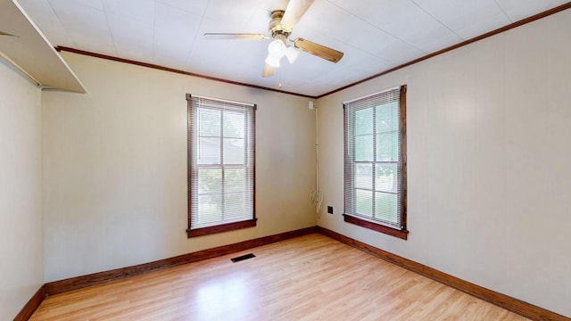 1009 5th Ave W, Springfield, TN 37172 - unfurnished room featuring crown molding, light wood-type flooring, plenty of natural light, and baseboards