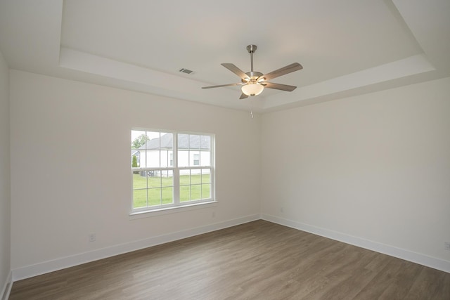 324 Fieldstone Ln, Springfield, TN 37172 - unfurnished room featuring a tray ceiling, ceiling fan, baseboards, and wood finished floors