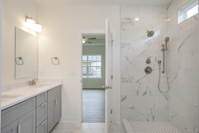 324 Fieldstone Ln, Springfield, TN 37172 - bathroom with double vanity, marble look tiles, plenty of natural light, and tiled shower