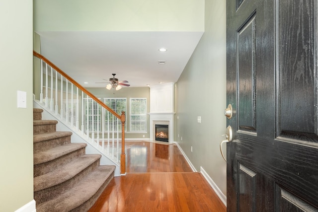 443 Lazy Creek Ln, Nashville, TN 37211 - entryway featuring wood finished floors, a fireplace, ceiling fan, stairway, and baseboards