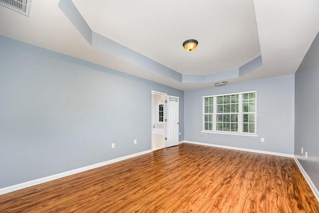 443 Lazy Creek Ln, Nashville, TN 37211 - empty room with a tray ceiling, wood finished floors, and baseboards