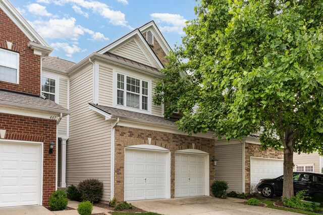 443 Lazy Creek Ln, Nashville, TN 37211 - view of front of home featuring a garage, driveway, a shingled roof, and brick siding