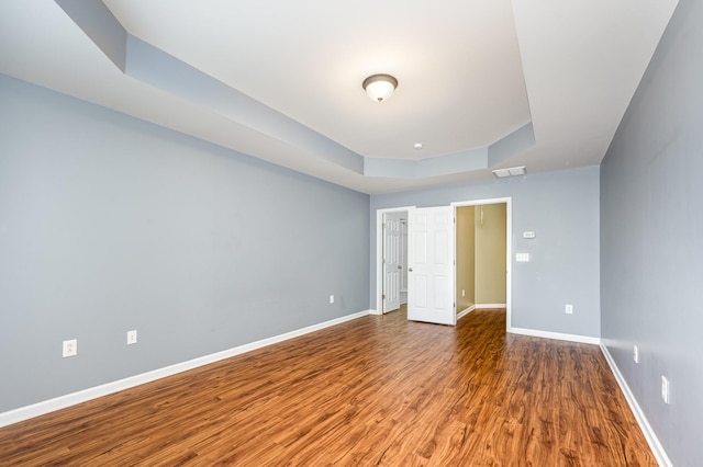 443 Lazy Creek Ln, Nashville, TN 37211 - unfurnished bedroom featuring wood finished floors, baseboards, and a raised ceiling