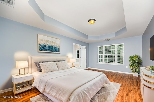 443 Lazy Creek Ln, Nashville, TN 37211 - bedroom with baseboards, wood finished floors, and a raised ceiling