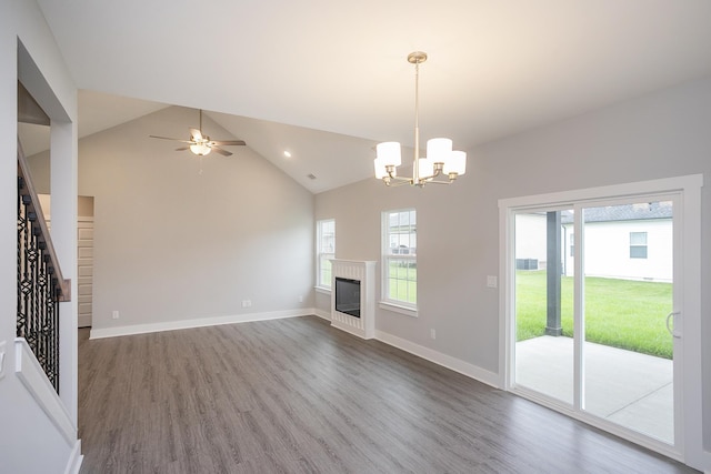 302 Fieldstone Ln, Springfield, TN 37172 - unfurnished living room with healthy amount of natural light, wood finished floors, a chandelier, and high vaulted ceiling