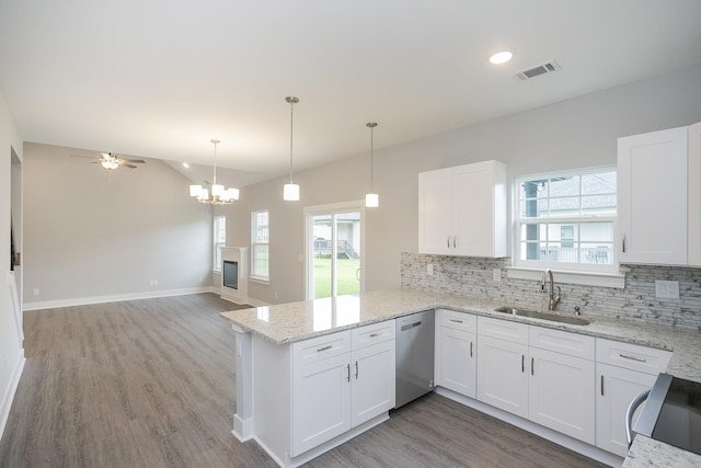 302 Fieldstone Ln, Springfield, TN 37172 - kitchen with stainless steel dishwasher, a sink, decorative backsplash, a peninsula, and recessed lighting
