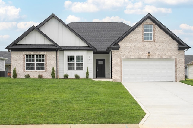 302 Fieldstone Ln, Springfield, TN 37172 - view of front of house with board and batten siding, a front yard, driveway, a shingled roof, and brick siding