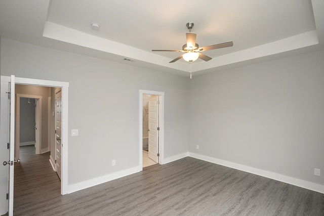 302 Fieldstone Ln, Springfield, TN 37172 - unfurnished bedroom featuring a raised ceiling, wood finished floors, baseboards, and ceiling fan