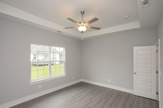 302 Fieldstone Ln, Springfield, TN 37172 - empty room with a raised ceiling, ceiling fan, wood finished floors, and baseboards