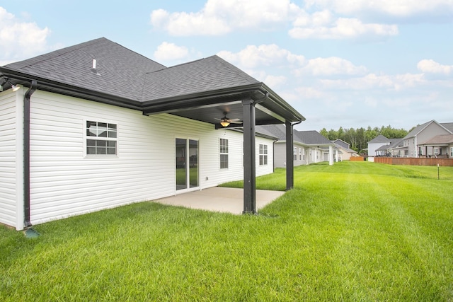 302 Fieldstone Ln, Springfield, TN 37172 - back of property featuring a ceiling fan, a shingled roof, a patio area, a yard, and a residential view