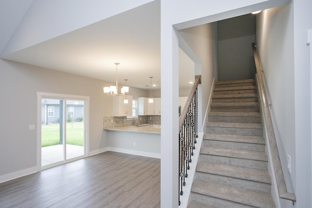 302 Fieldstone Ln, Springfield, TN 37172 - stairway with wood finished floors, a chandelier, recessed lighting, and baseboards