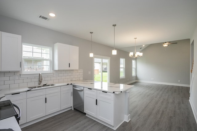 340 Fieldstone Ln, Springfield, TN 37172 - kitchen featuring dishwasher, a sink, a peninsula, tasteful backsplash, and dark wood finished floors