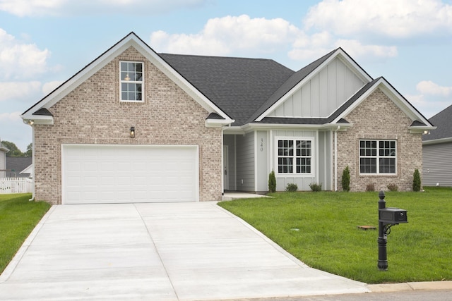 340 Fieldstone Ln, Springfield, TN 37172 - view of front of house with board and batten siding, a front yard, driveway, and brick siding