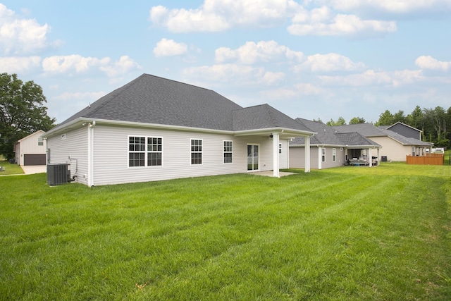 340 Fieldstone Ln, Springfield, TN 37172 - rear view of house featuring central air condition unit, a yard, and a shingled roof