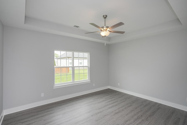340 Fieldstone Ln, Springfield, TN 37172 - unfurnished room featuring a raised ceiling, dark wood finished floors, and ceiling fan