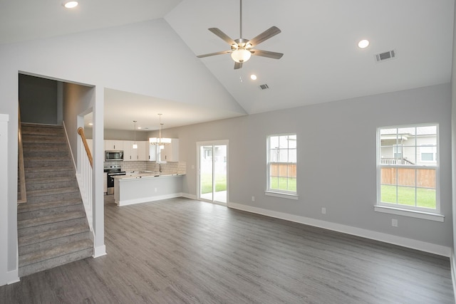 340 Fieldstone Ln, Springfield, TN 37172 - unfurnished living room featuring high vaulted ceiling, ceiling fan, stairs, dark wood-style flooring, and recessed lighting