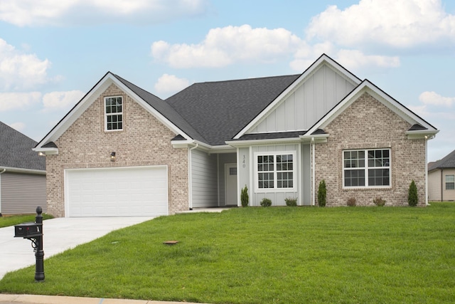 340 Fieldstone Ln, Springfield, TN 37172 - view of front of house featuring board and batten siding, brick siding, driveway, a front lawn, and roof with shingles