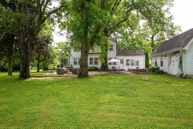 207 Cumberland Cir, Nashville, TN 37214 - rear view of house with a patio, a lawn, and an outdoor hangout area