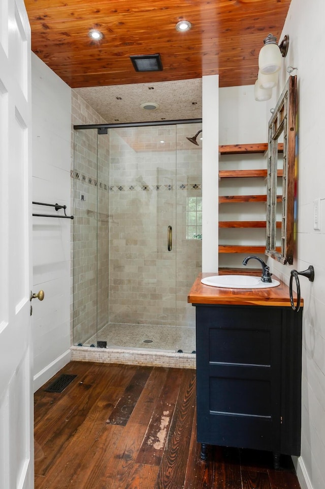 207 Cumberland Cir, Nashville, TN 37214 - full bathroom featuring a stall shower, vanity, wood ceiling, hardwood / wood-style flooring, and recessed lighting