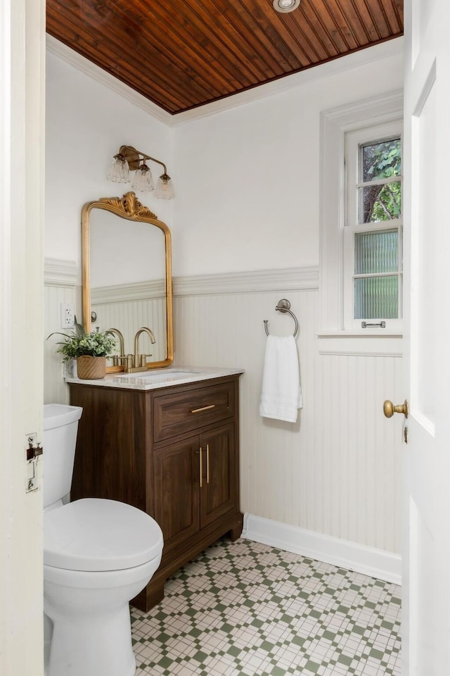 207 Cumberland Cir, Nashville, TN 37214 - bathroom with tile patterned floors, a wainscoted wall, vanity, wooden ceiling, and toilet