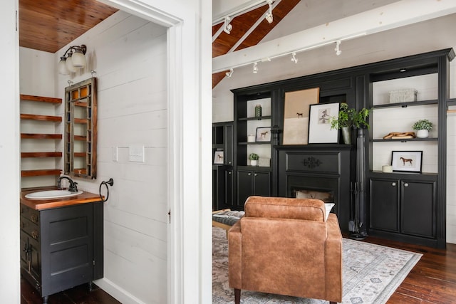 207 Cumberland Cir, Nashville, TN 37214 - living area with track lighting, dark wood finished floors, a fireplace, and wood ceiling