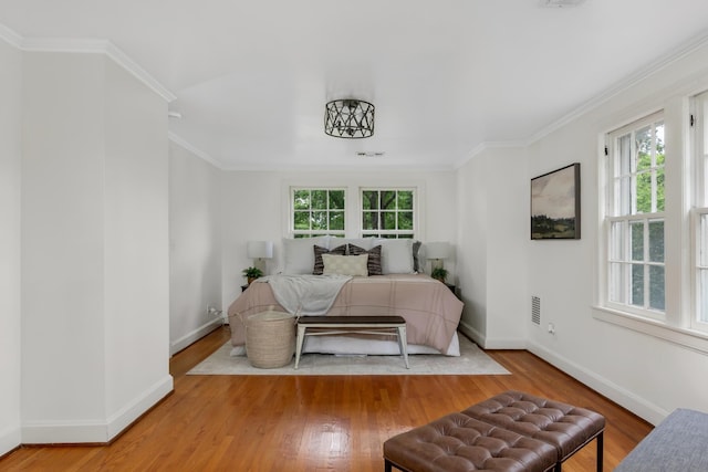 207 Cumberland Cir, Nashville, TN 37214 - bedroom with multiple windows, wood finished floors, baseboards, and crown molding