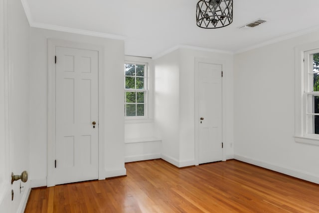 207 Cumberland Cir, Nashville, TN 37214 - foyer entrance with light wood-style flooring, crown molding, and baseboards