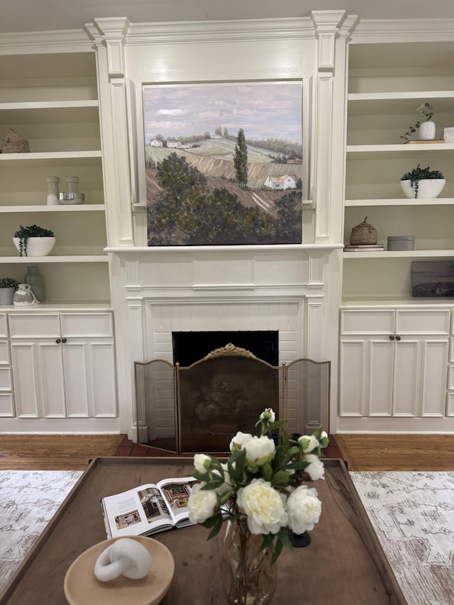 207 Cumberland Cir, Nashville, TN 37214 - living area with decorative columns, wood finished floors, a brick fireplace, and ornamental molding