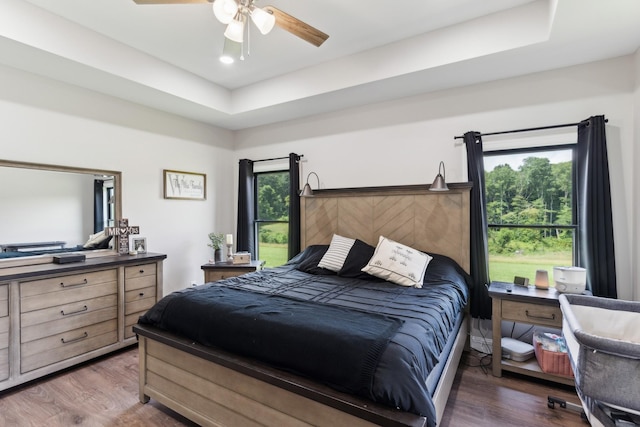 468 Olin Bean Rd, Red Boiling Springs, TN 37150 - bedroom featuring wood finished floors, ceiling fan, and a raised ceiling