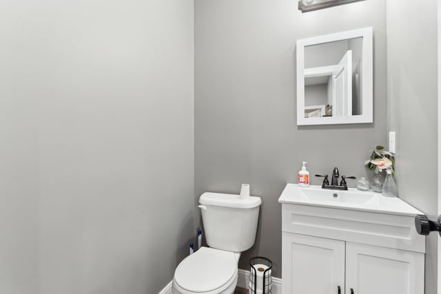 468 Olin Bean Rd, Red Boiling Springs, TN 37150 - half bathroom with toilet, baseboards, and vanity