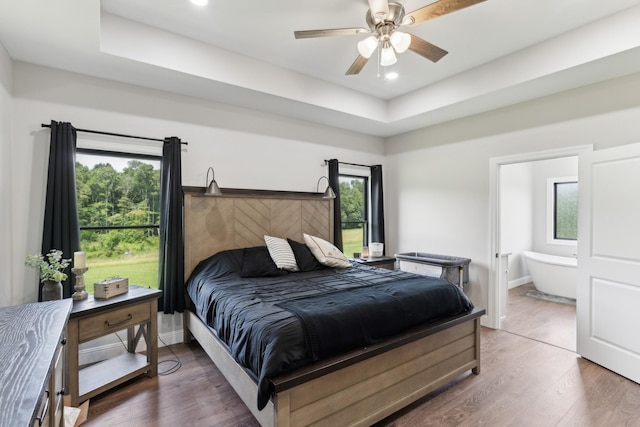 468 Olin Bean Rd, Red Boiling Springs, TN 37150 - bedroom featuring wood finished floors, recessed lighting, ensuite bath, a raised ceiling, and a ceiling fan