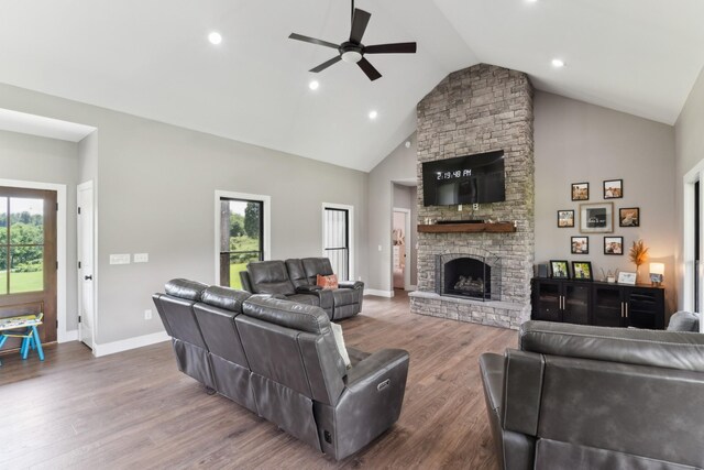468 Olin Bean Rd, Red Boiling Springs, TN 37150 - living room with a ceiling fan, high vaulted ceiling, wood finished floors, baseboards, and a stone fireplace
