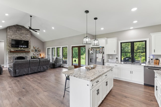 468 Olin Bean Rd, Red Boiling Springs, TN 37150 - kitchen featuring stainless steel appliances, a sink, a ceiling fan, open floor plan, and a stone fireplace