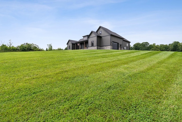 468 Olin Bean Rd, Red Boiling Springs, TN 37150 - view of green lawn featuring an attached garage and a sunroom