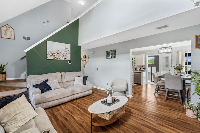 304 Hank Aaron Cv, La Vergne, TN 37086 - living room with wood finished floors, baseboards, and a towering ceiling